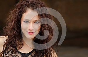 Young woman with curly dark hair