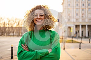 Young woman with curly hair in the city