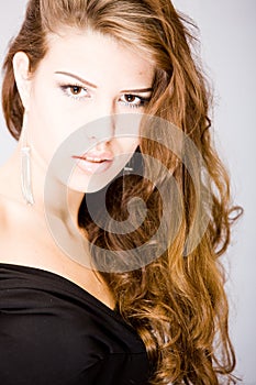 Young woman with curly splendid long hair photo