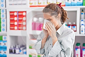 Young woman customer using napkin at pharmacy