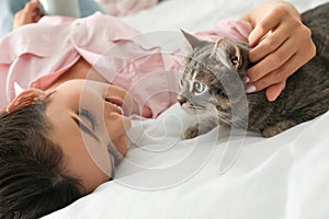 Young woman with cute cat. Pet and owner