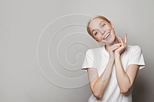 Young woman with cute perfect smile, studio portrait