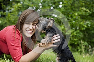 Young woman with cute puppy