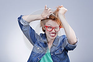 Young woman cuts her hair with scissors Hairdressing