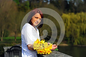 Young woman with daffodils