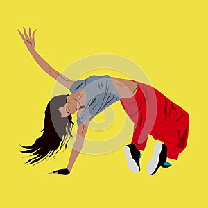 Young woman dancing hip-hop or break-dance on the floor