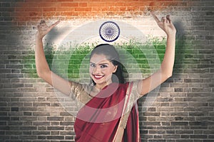 Young woman dancing with India flag background