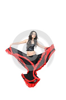 Young woman dancing latino over white