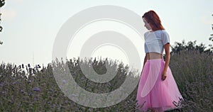 Young woman dancing in the lavanda field