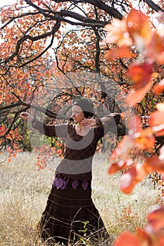 Young woman dancing ritual dance mandala