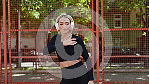 Young Woman Dancing To Music In Headphones