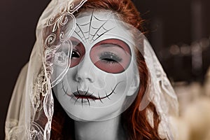 Young woman in day of the dead mask
