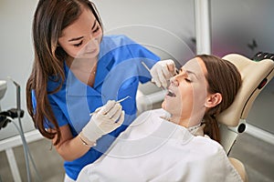 Young woman at the dentist.Dentists at work..Regular dentist visit. Caries cure