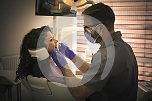 Young woman at dentist examination.