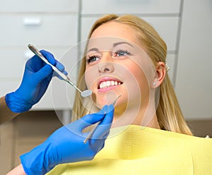 Young woman in dentist office for dental exam