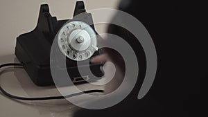 Young Woman Dial On Old Rotary Telephone
