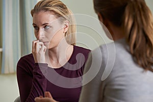 Young Woman Discussing Problems With Counselor