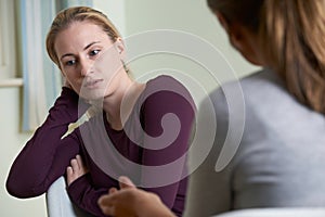 Young Woman Discussing Problems With Counselor