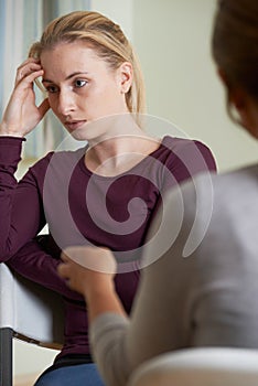 Young Woman Discussing Problems With Counselor