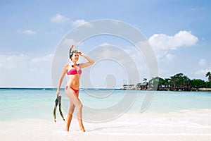 Young woman in divind equipment on the sea