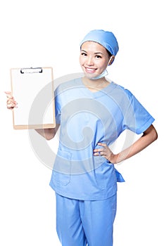 Young woman doctor with blank clipboard