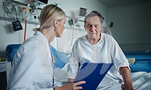 Young woman doctor explaining diagnosis to her patient.