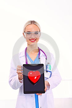 Young woman doctor holding a red heart, isolated on white background. Woman doctor