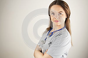 Young woman doctor or nurse wearing scrubs