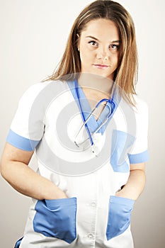 Young woman doctor or nurse wearing scrubs