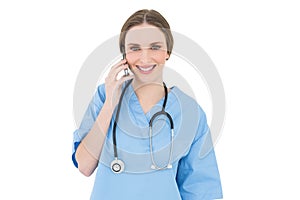 Young woman doctor phoning with her smartphone