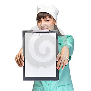 Young woman doctor showing empty blank clipboard