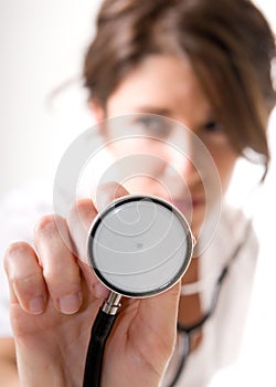 Young woman doctor with stethoscope