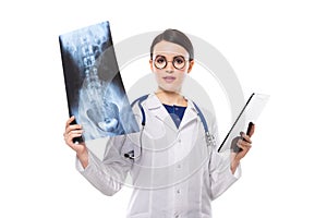 Young woman doctor with stethoscope looking at x-ray making diagnosis in white uniform on white background