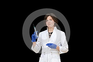 Young woman doctor with syringe isolated on black background