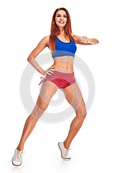 Young woman does exercise on tiptoes