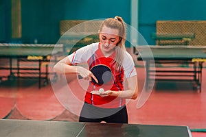 Young woman does lodge in table tennis photo