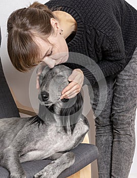 Young woman with dog at home leisure. stayhome concept