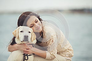 Young woman, dog labrador