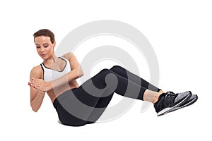 Young woman doing abs exercises, russian twist, isolated