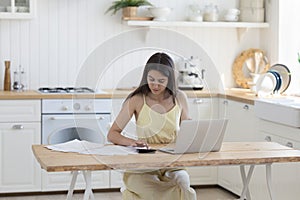 Young woman doing accounting work from home