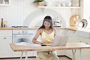 Young woman doing accounting work from home