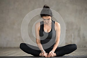Young woman doing Butterfly exercise
