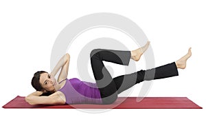 Young woman doing crunch during workout