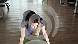 Young woman doing exercise on bosu ball. Top view