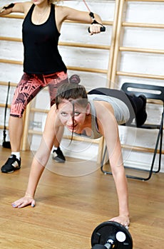 Young woman doing exercise in gym