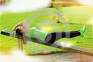 Young woman doing exercise outdoors photo