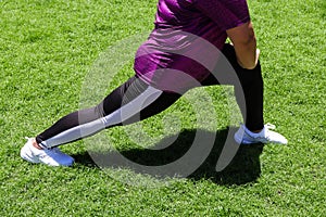 Young woman doing exercise or stretching before running outdoor.