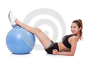 Young woman doing exercises with fitness ball.