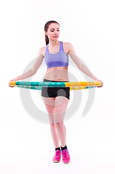 Young woman doing exercises with hoop