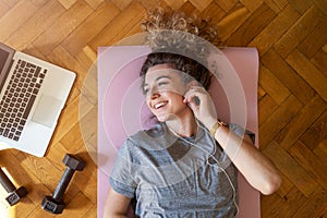 Young woman doing fitness exercise at home